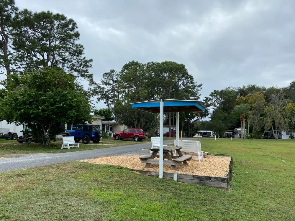 Shaded picnic gazebo on the green at Sunny Shores RV Resort