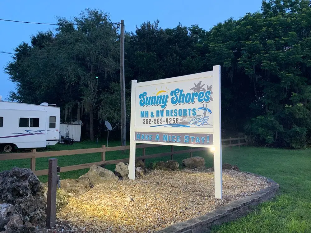 Sunny Shores entrance sign at dusk — Have a Nice Stay!
